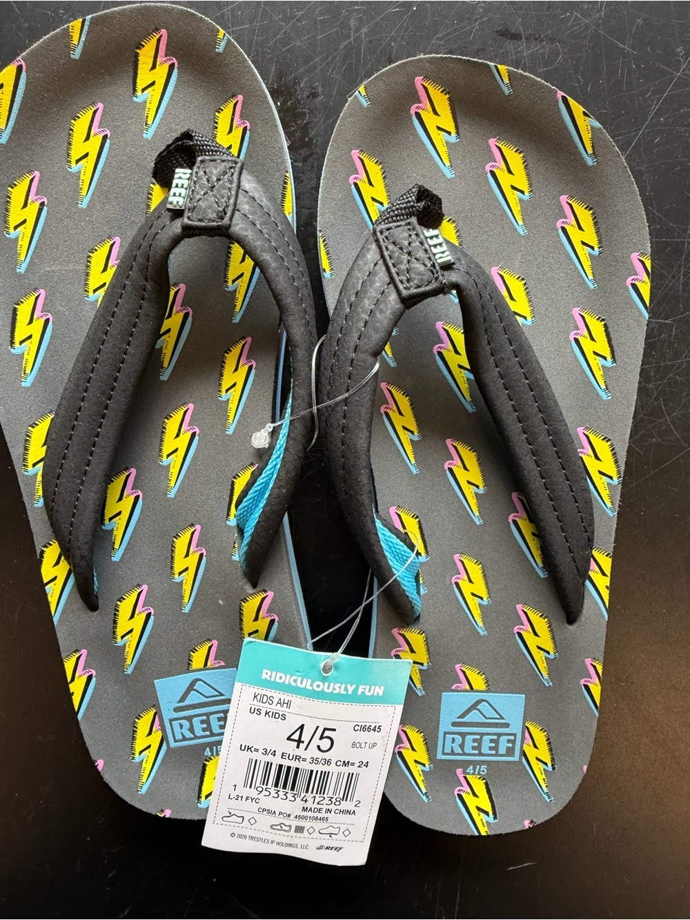 Reef Kids Black Flip-Flops with Yellow & Pink Lightning Size 4/5